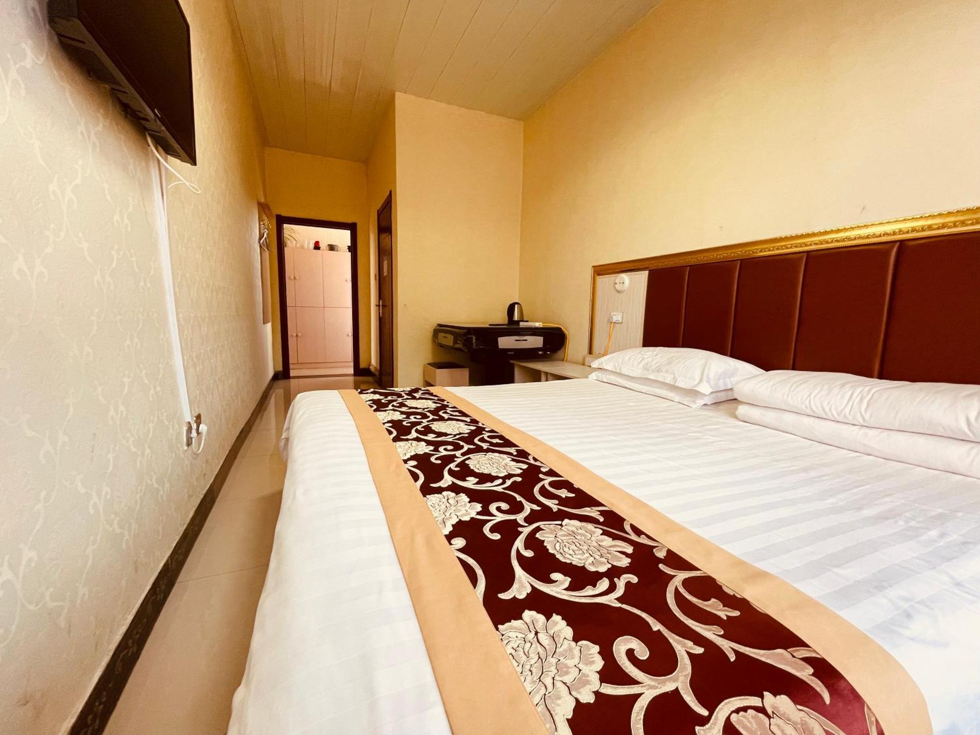 哈尔滨机场东方红运宾馆 Hotell Rom bilde