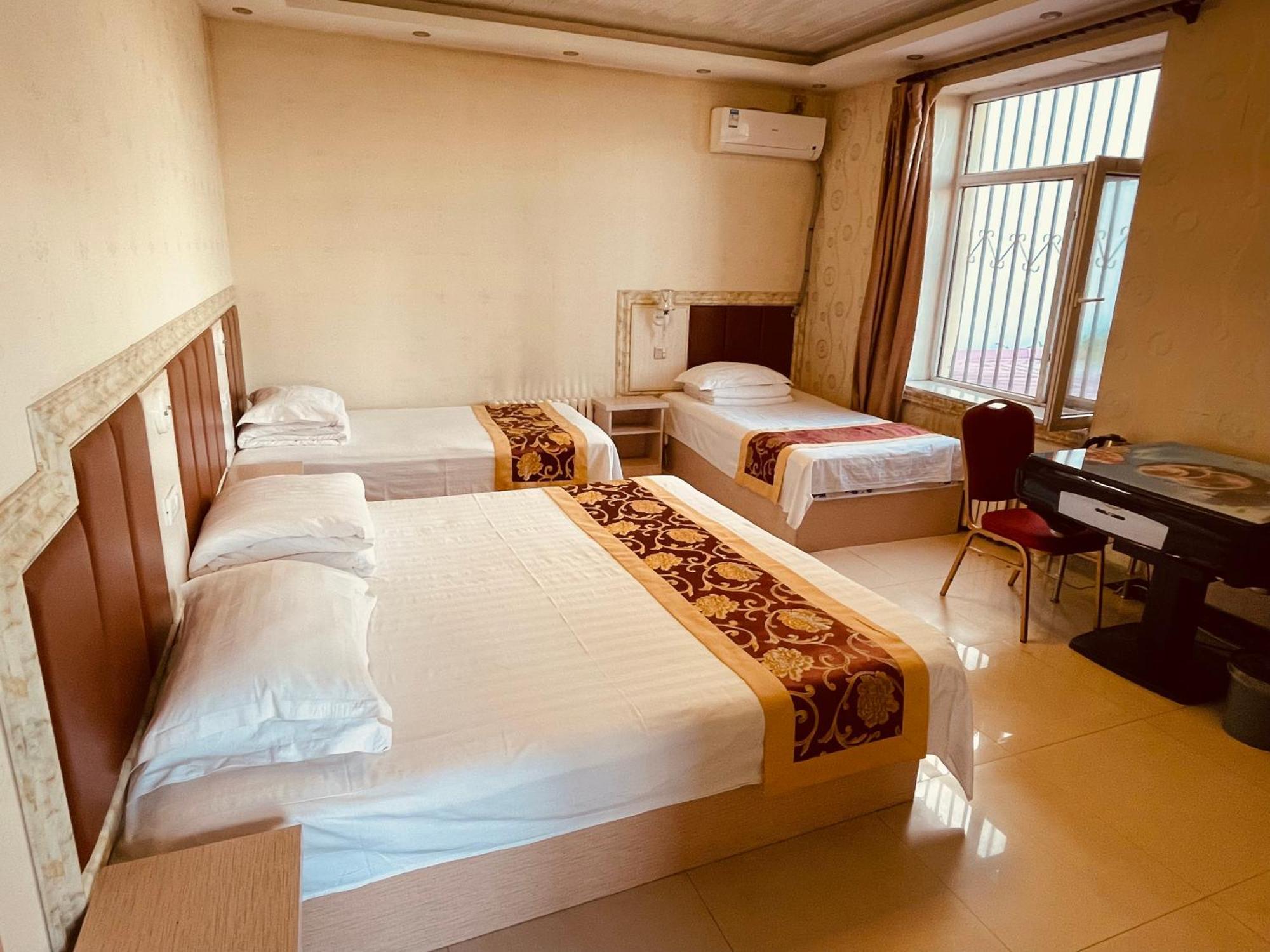 哈尔滨机场东方红运宾馆 Hotell Rom bilde